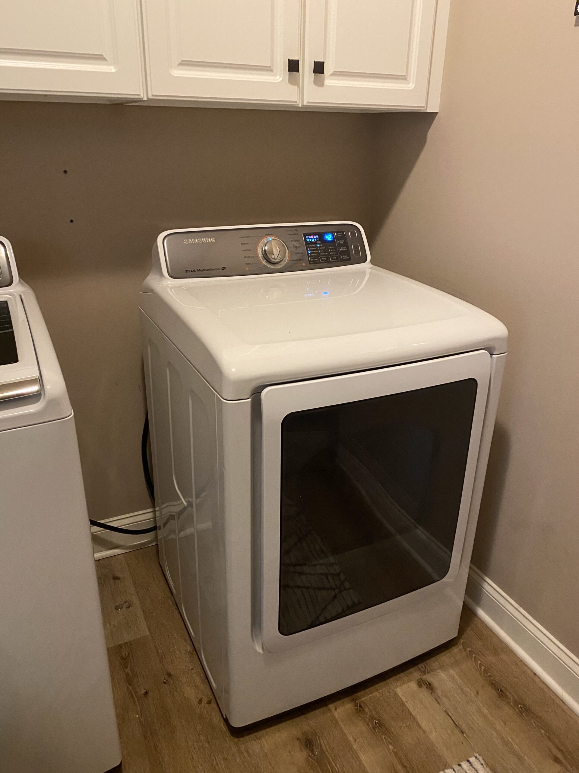 Repaired Samsung model DV48H7400EWA2 dryer in Louisville, Ohio: New heat element installed.