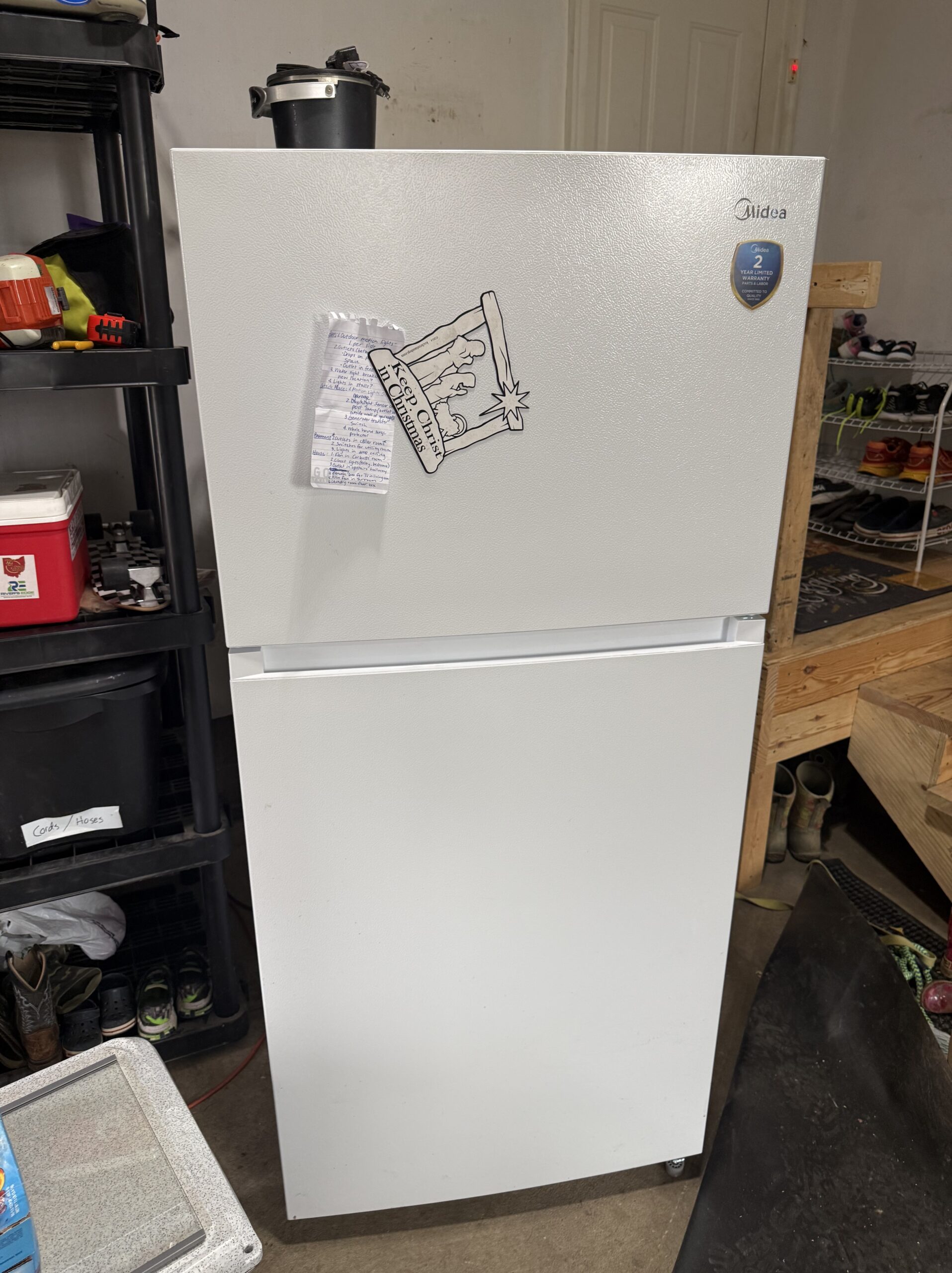 Midea MRT18D3BWW refrigerator with inverter board issue being inspected by technician Samuel Willhite in Louisville, Ohio.