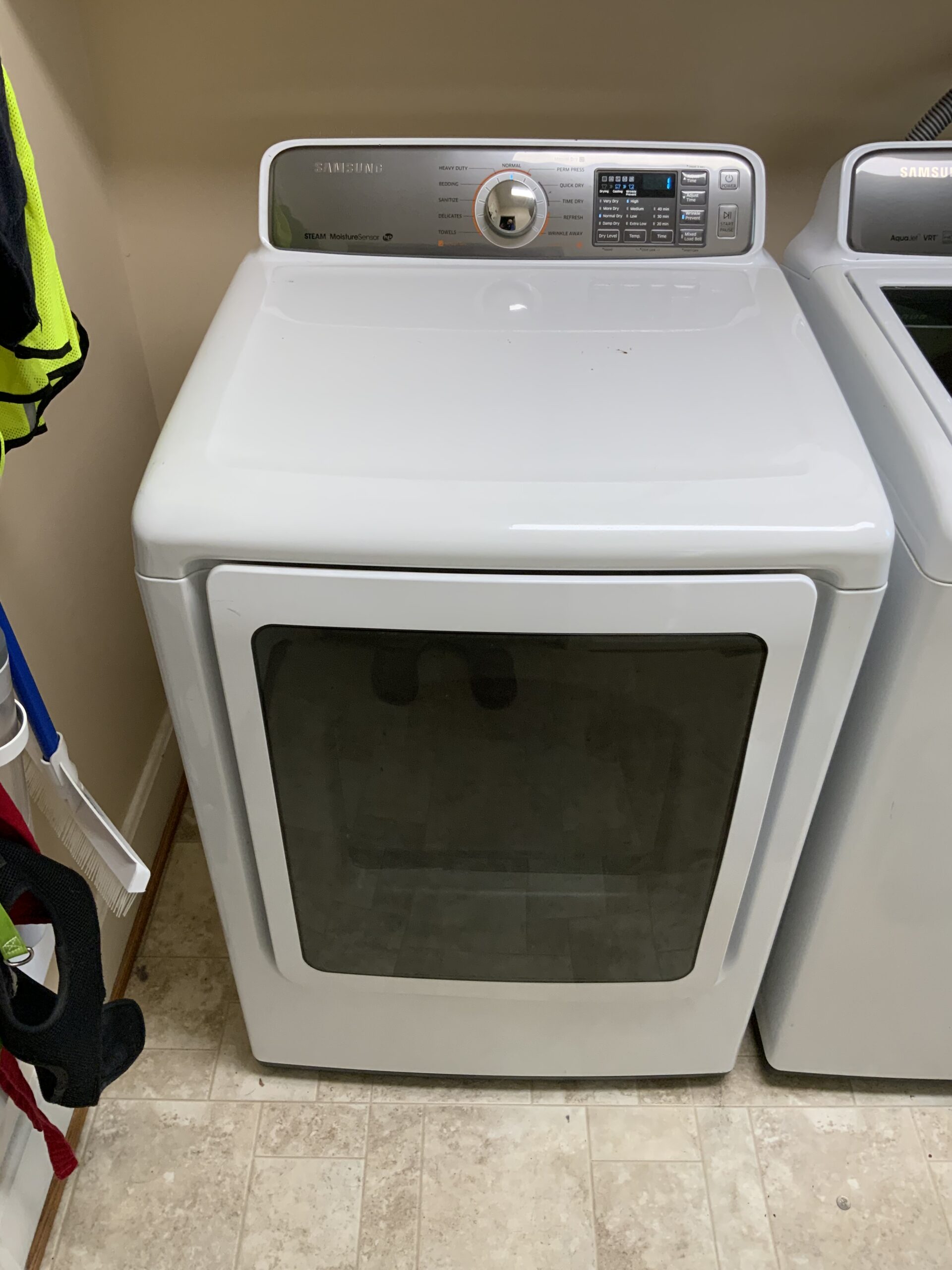 Samsung Dryer DV48H7400EW/A2 with replaced idler pulley, repaired by technician Samuel Willhite.