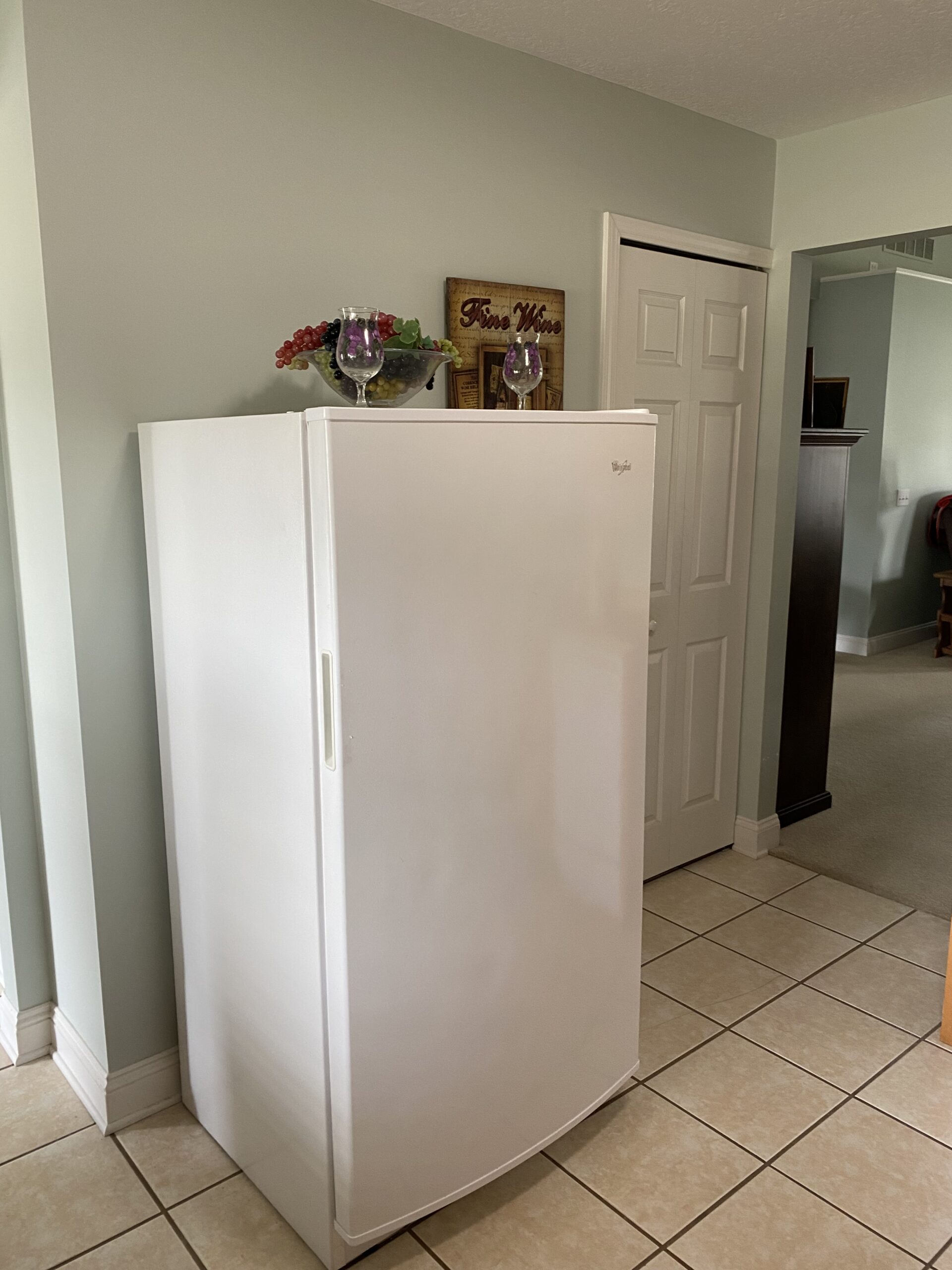 Repair of Whirlpool upright freezer model WZF34X16DW00 in Louisville, Ohio, involving a thermistor replacement.