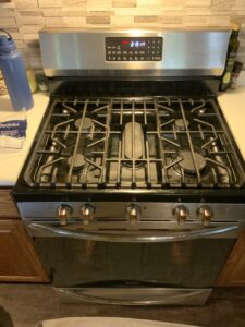 Gas range repair in Hartville OH: Frigidaire GCRG3060AFB igniter wire harness replacement