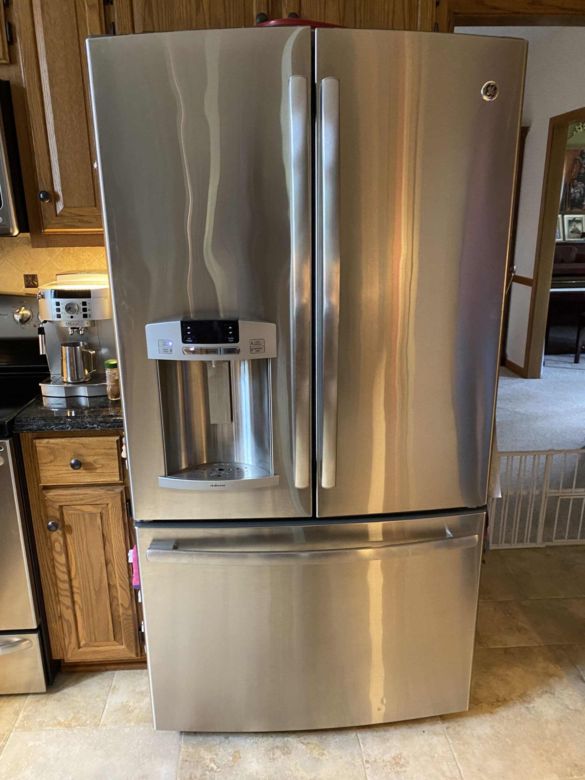 GE refrigerator model DFE29JSDASS fan replacement at Hartville residence.