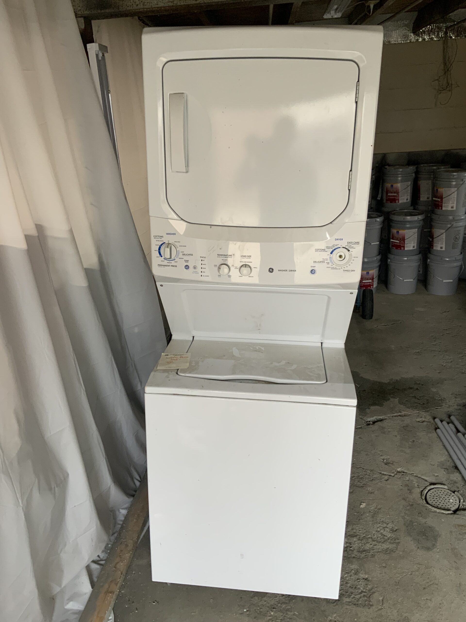 GE Washer model GTUP270EM2WW with replaced parts after repair in Paris, OH.