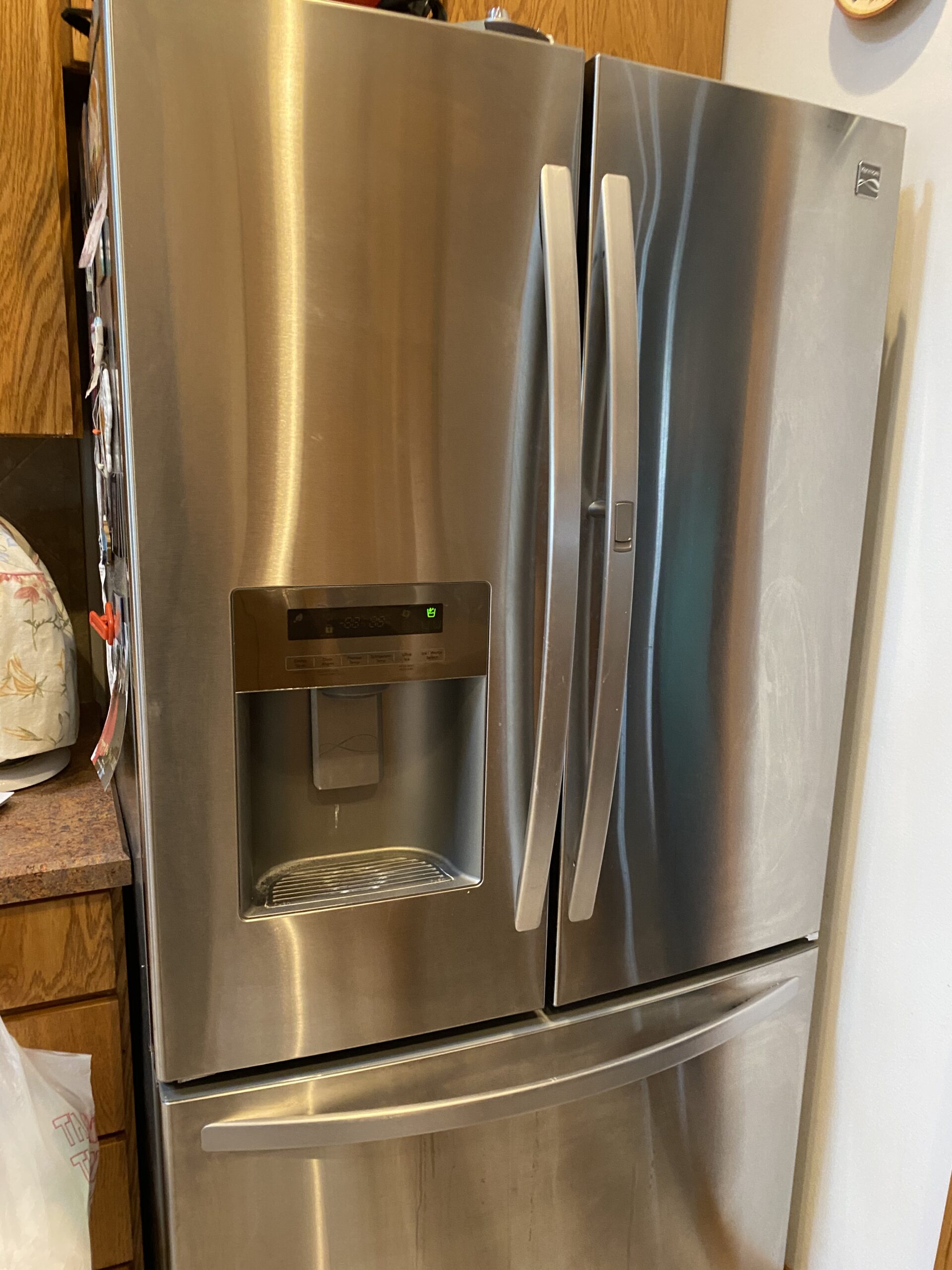Technician Samuel Willhite repairs a Kenmore refrigerator's ice maker model 795.70333.40 in Canton, Ohio.