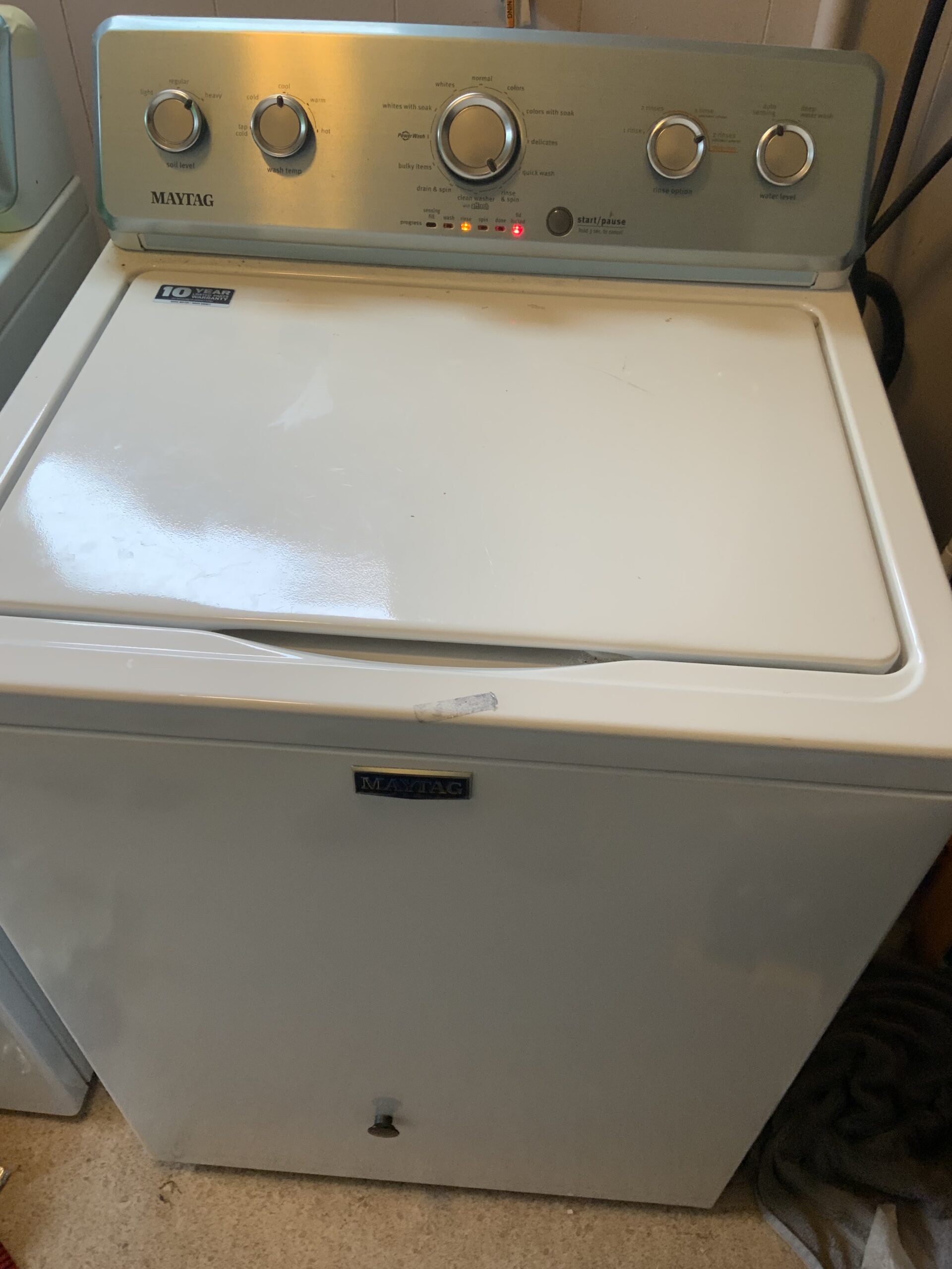 Maytag Washer MVWC465HW2 being repaired by a technician in Alliance, Ohio.
