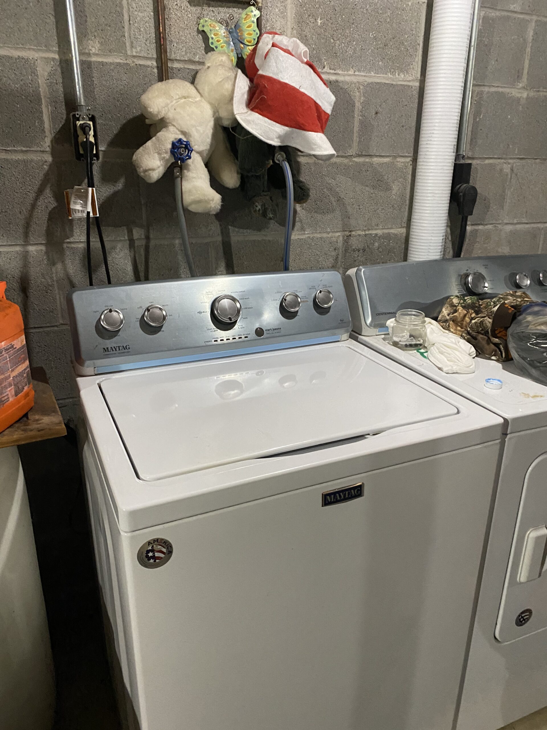 Maytag Washer MVWC565FW0 being repaired by a technician.