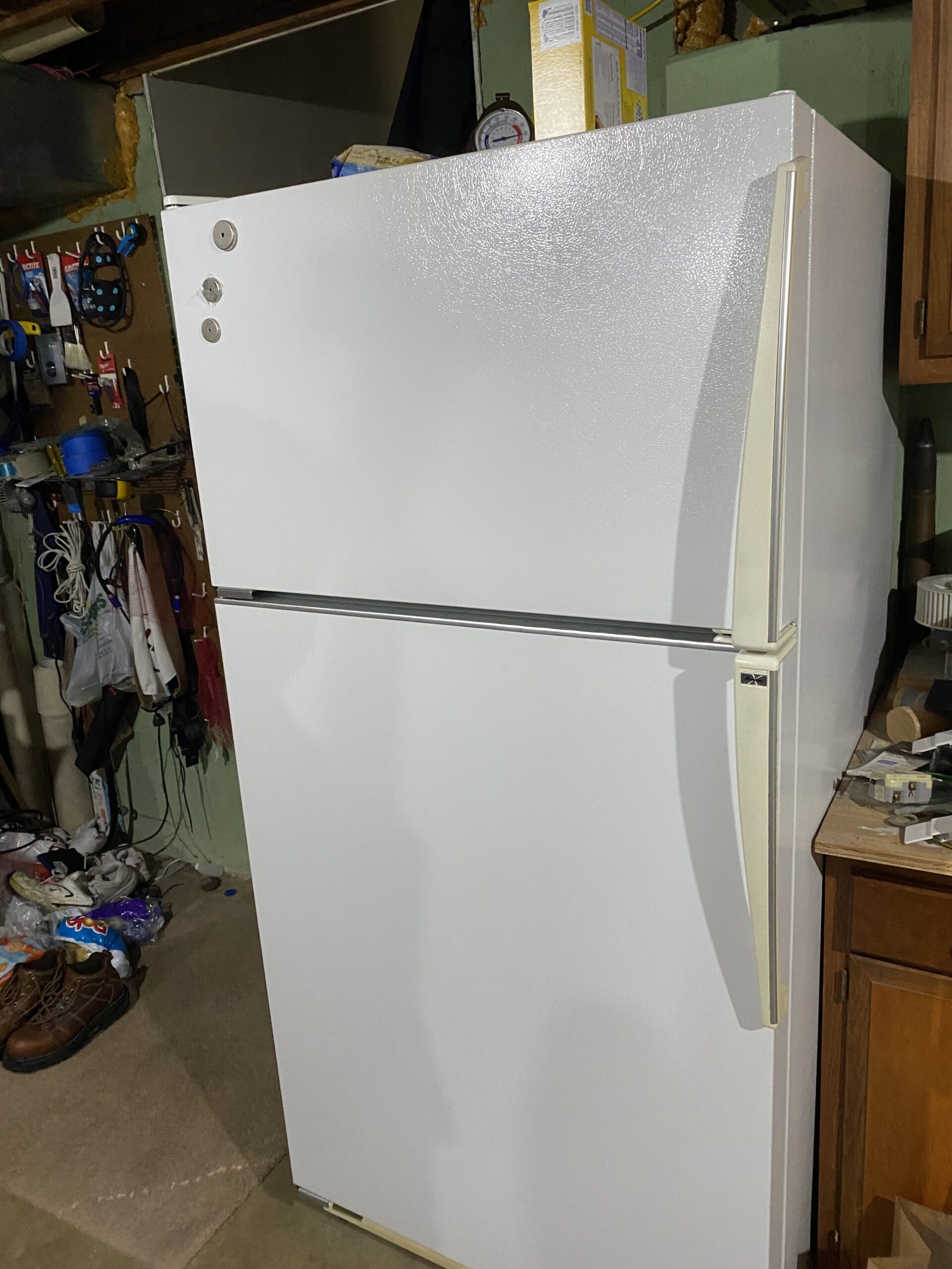 Amana refrigerator model TZ21Q2W with thermostat repair in progress.