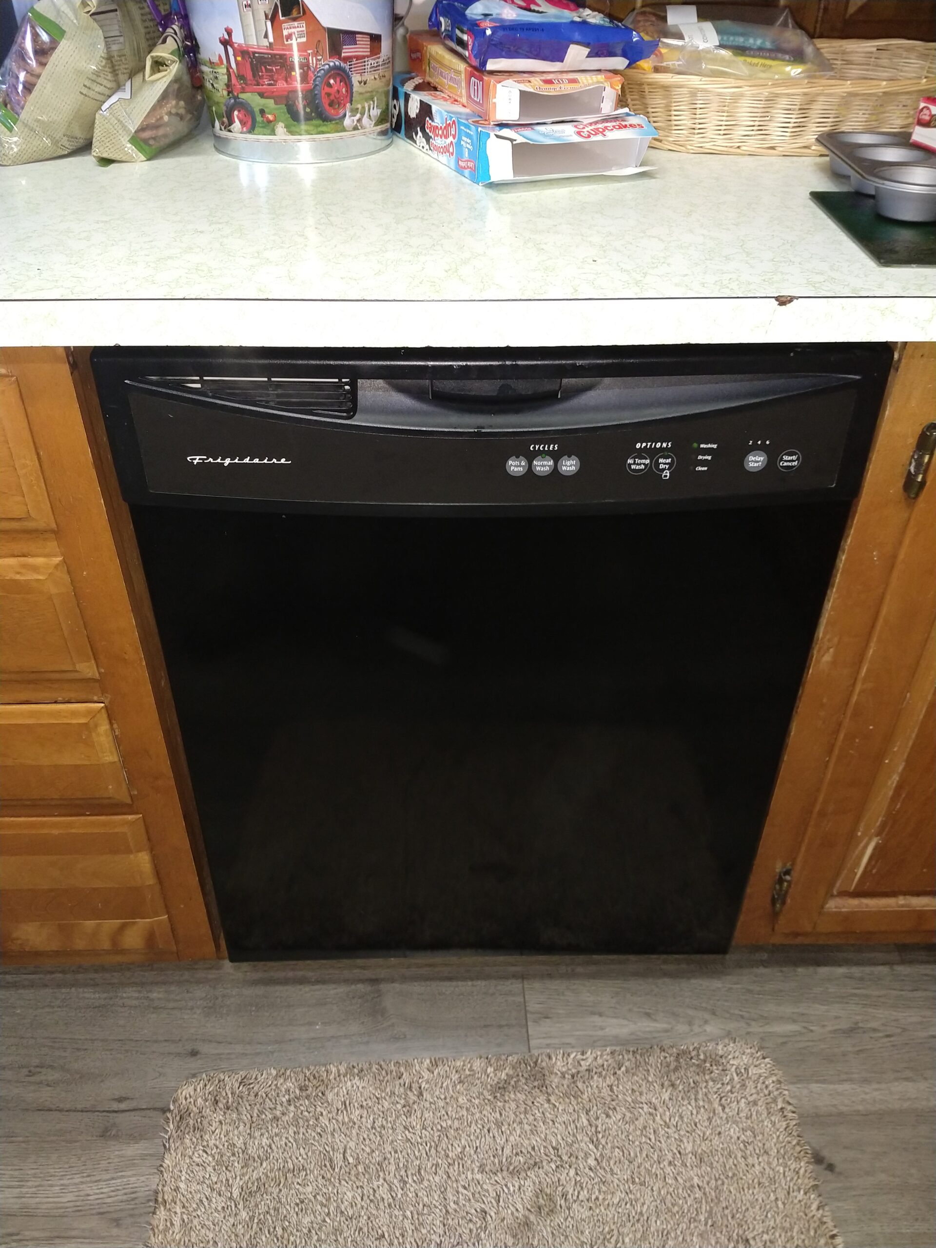Louisville Appliance Repair technician fixes Frigidaire dishwasher's drainage issue.