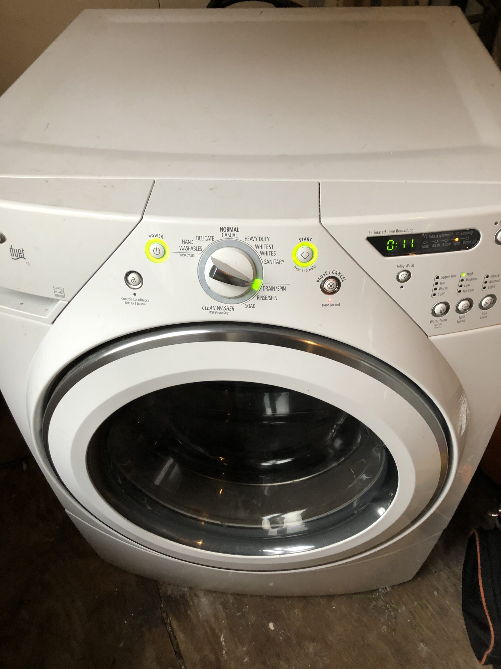 Samuel Willhite repairing Whirlpool washer model WFW9200SQ00's motor control board.