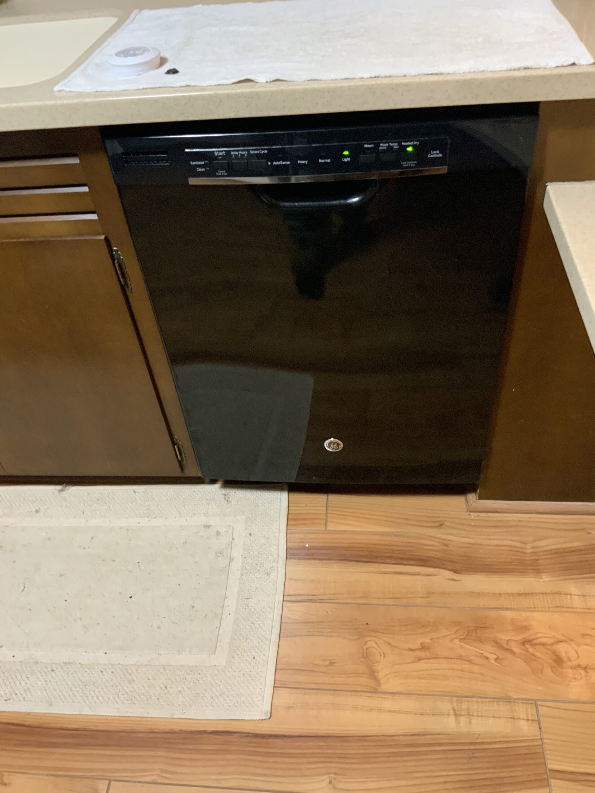 Samuel Willhite repairing a GE dishwasher in Strasburg, Ohio.