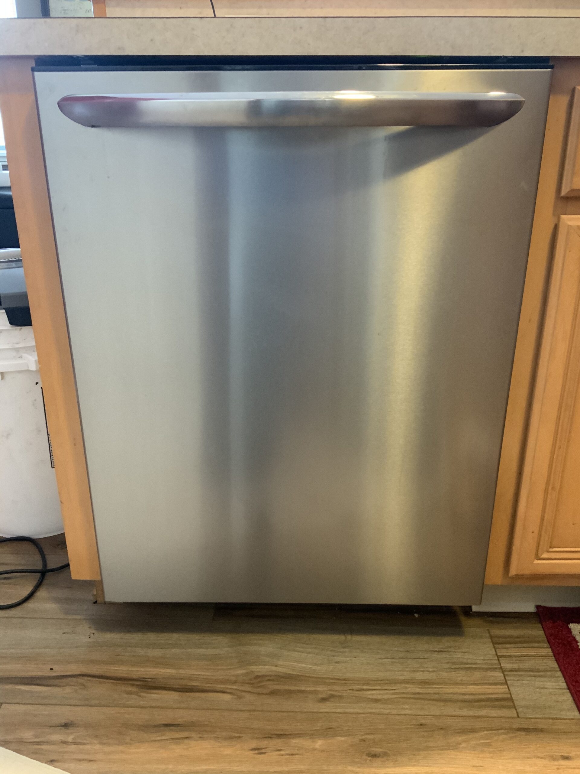 Technician Samuel Willhite repairing an Admiral dishwasher FGID2474QF0B in Massillon, Ohio.