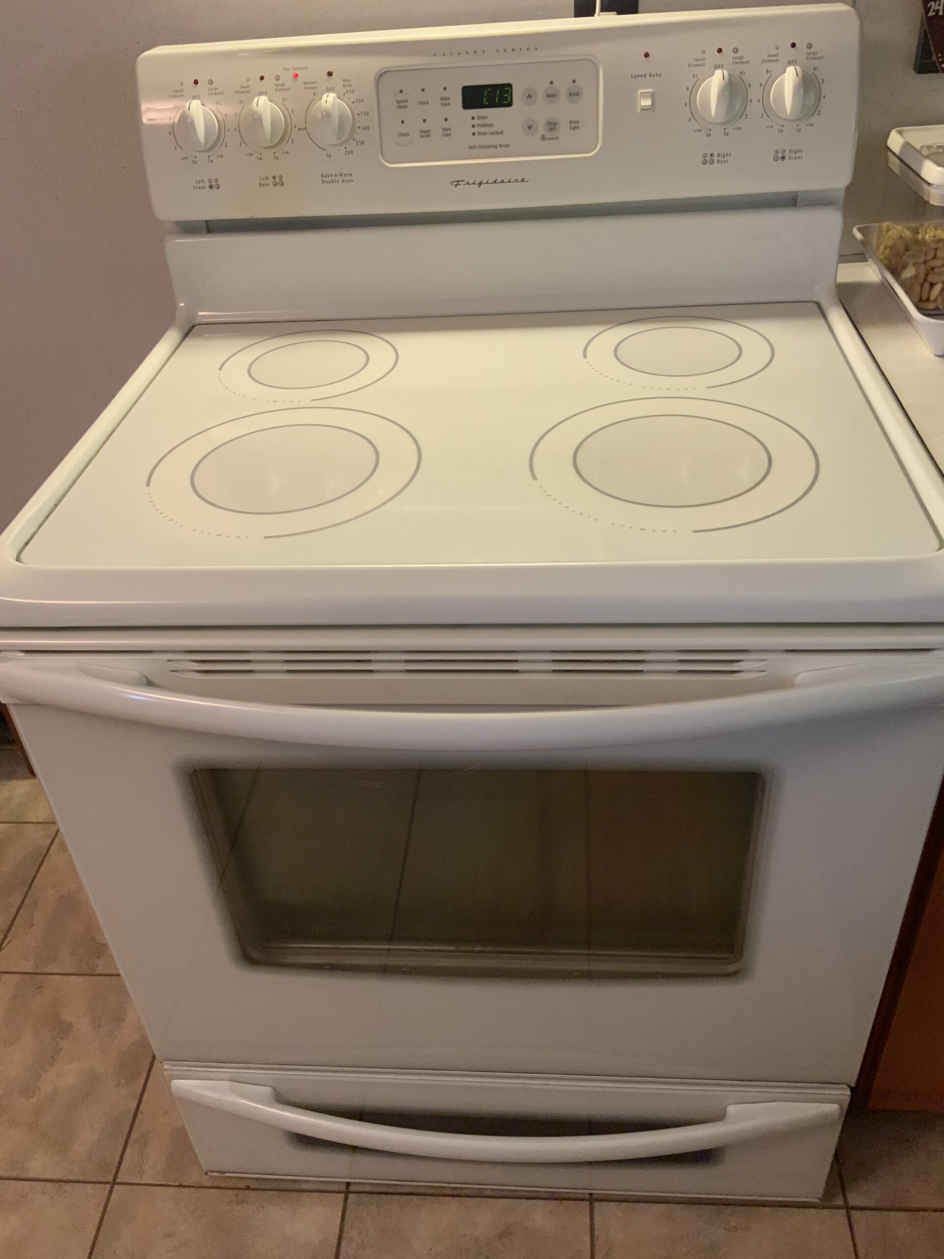 Frigidaire oven model GLEFM385DSH with repaired right front burner switch.