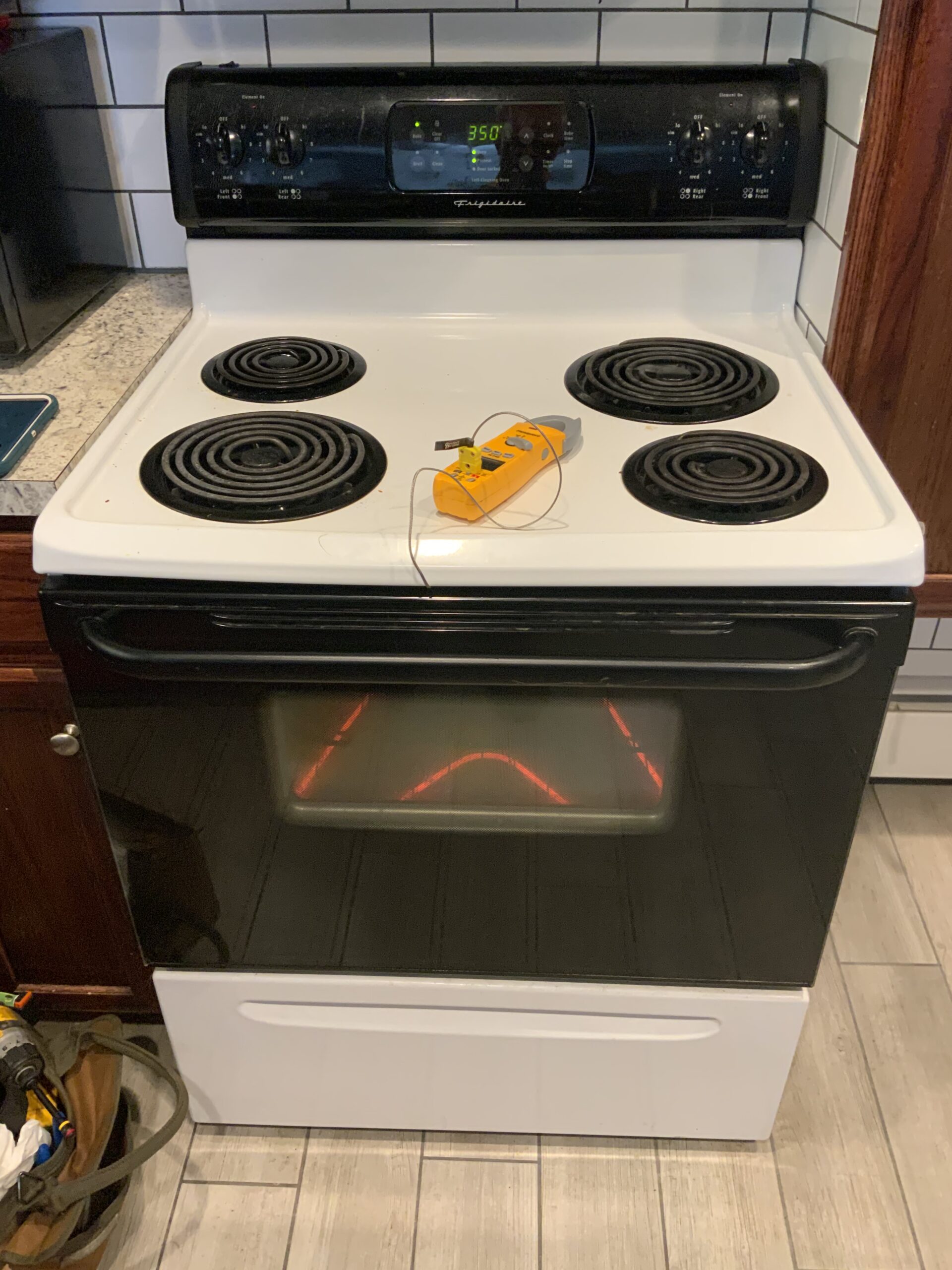 Frigidaire oven model FEF352AWF undergoing control board replacement.