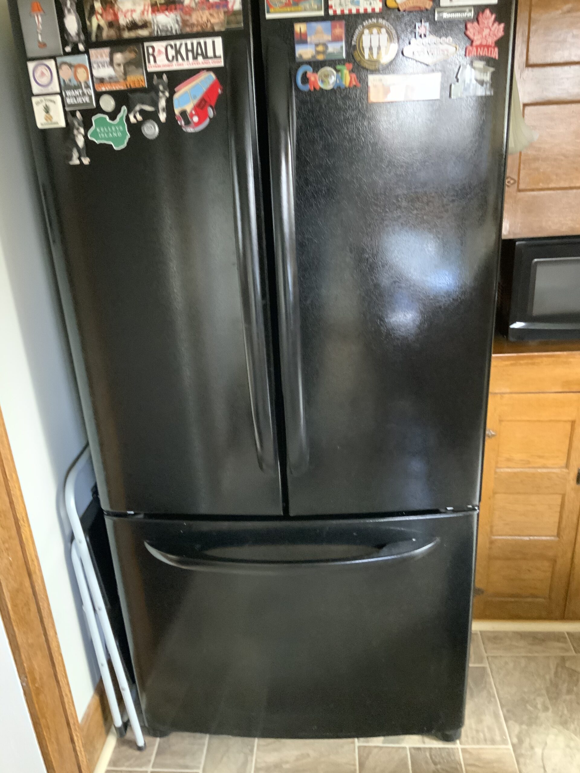 Kenmore refrigerator model 795 undergoing light assembly repair by Louisville Appliance Repair.