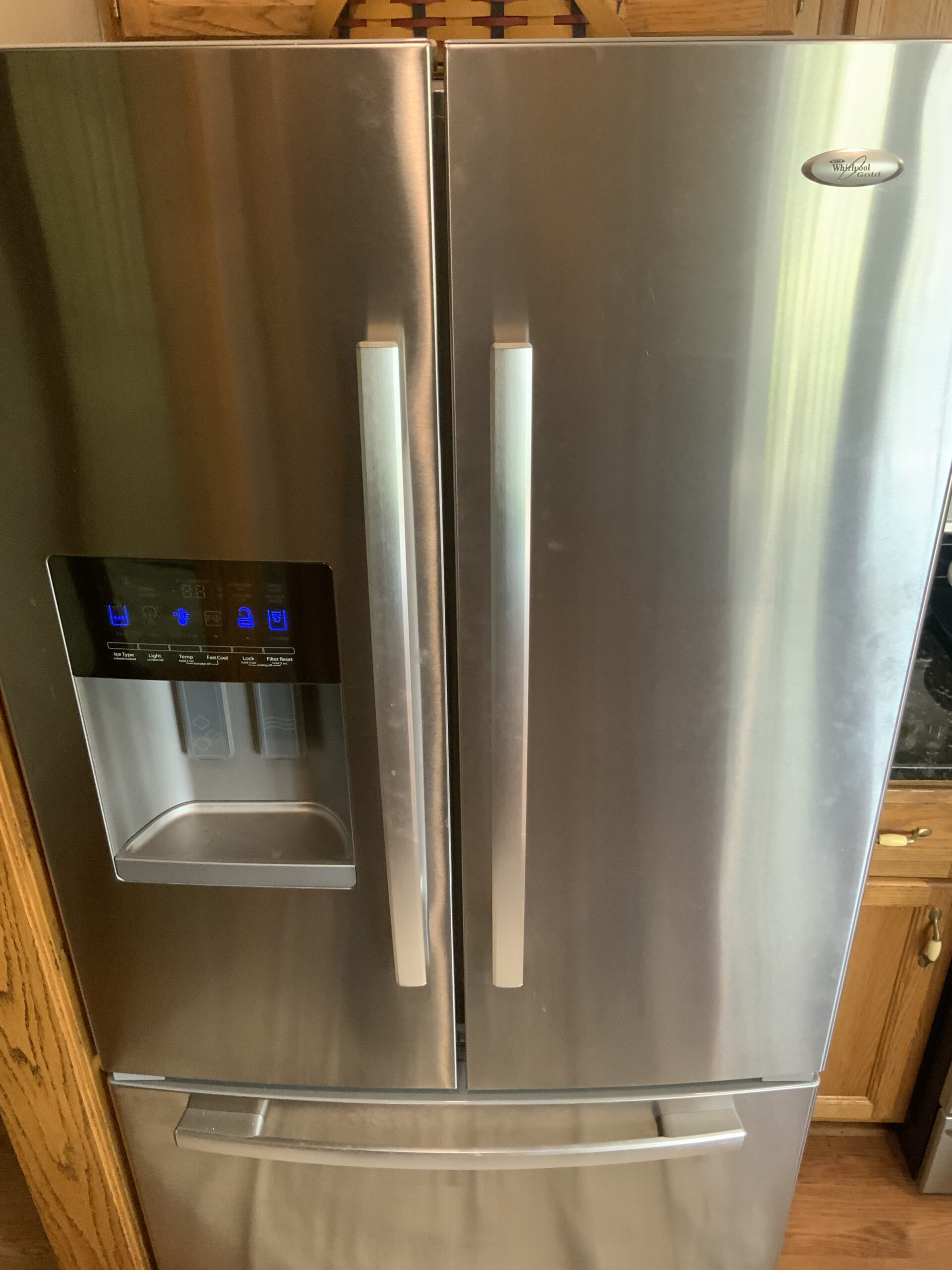 Technician repairing Whirlpool freezer model GI6SDRXXY02 in Louisville, OH.