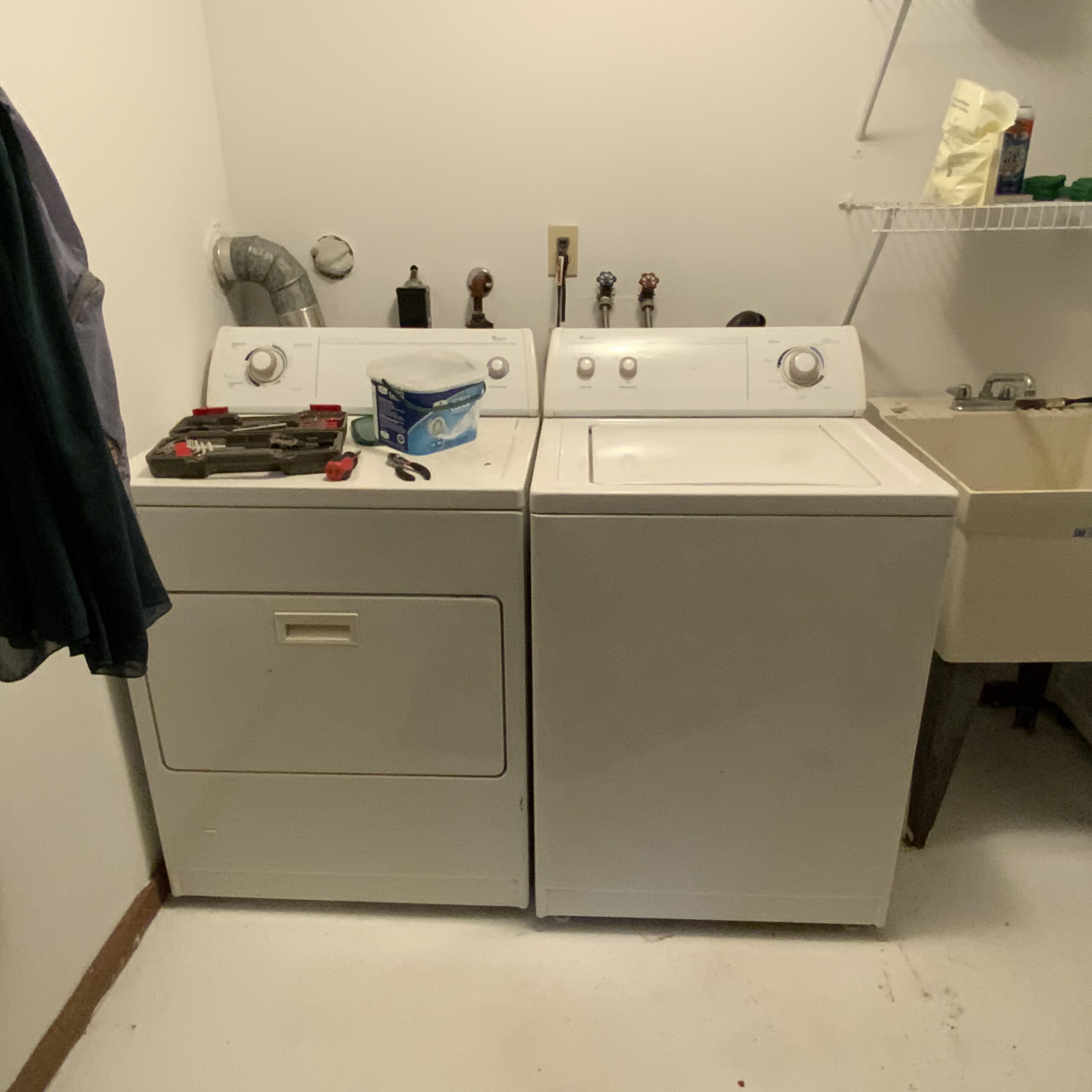 Technician Samuel Willhite replaces lid switch in Whirlpool washer model LSR7133KQ0 in Malvern, Ohio.