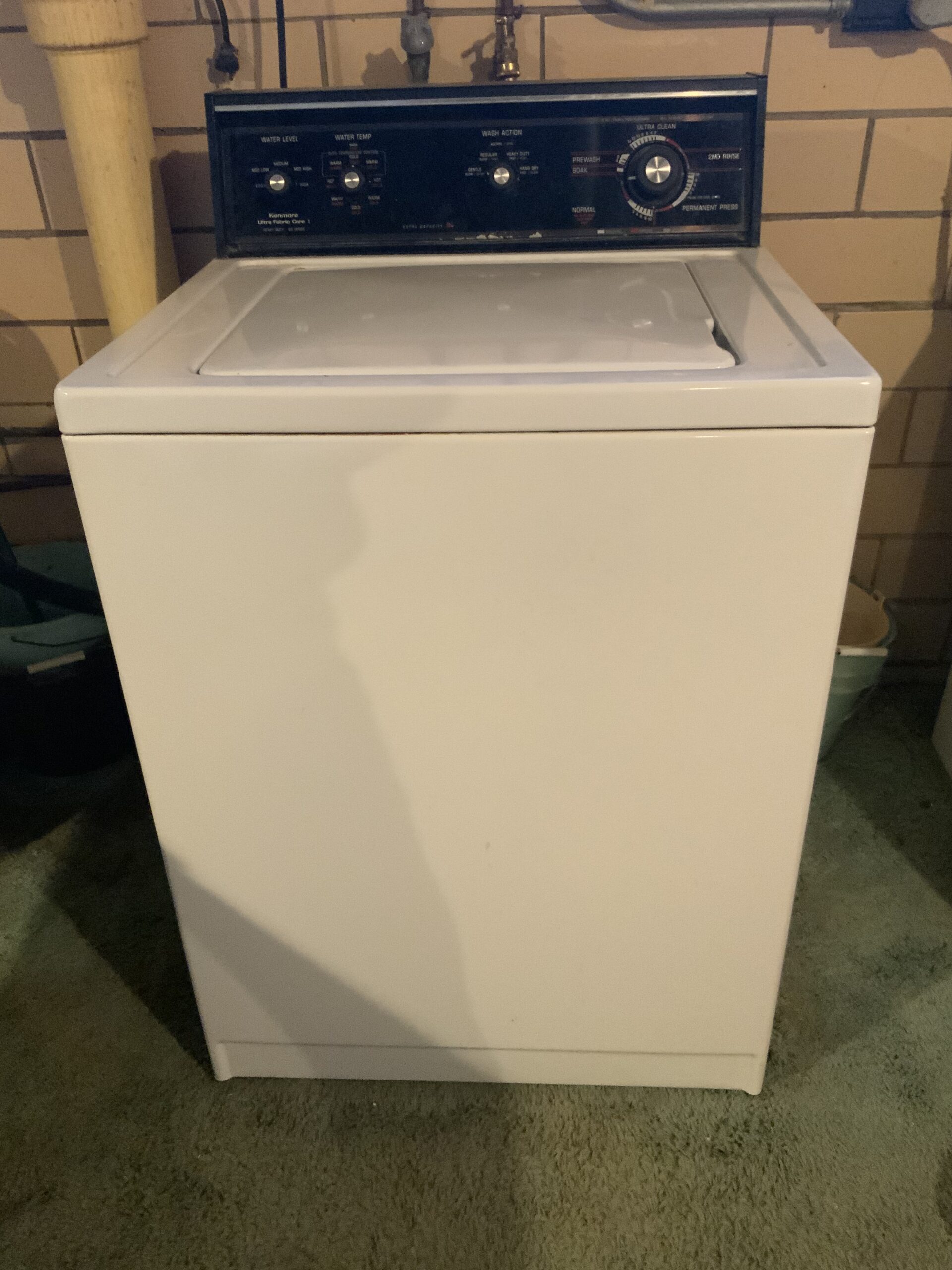 Closed view of Whirlpool washer showing the newly installed lid switch.