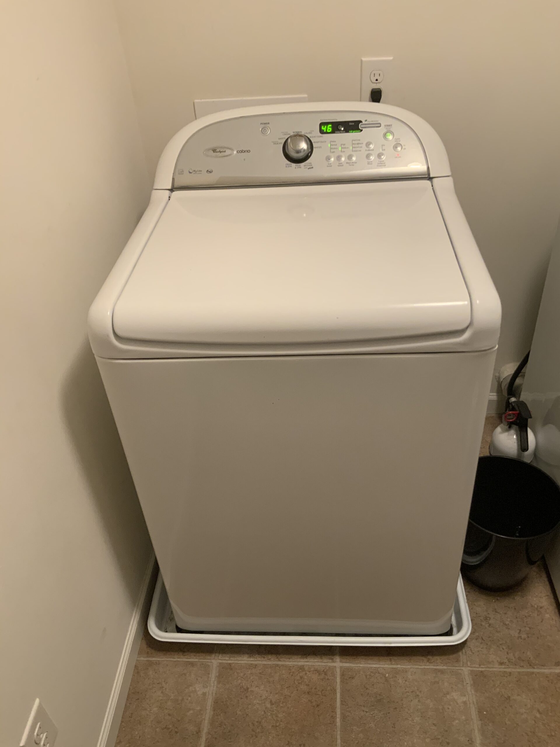 Whirlpool washer model WTW7340XW2 repaired in Louisville, Ohio with a newly replaced top panel.