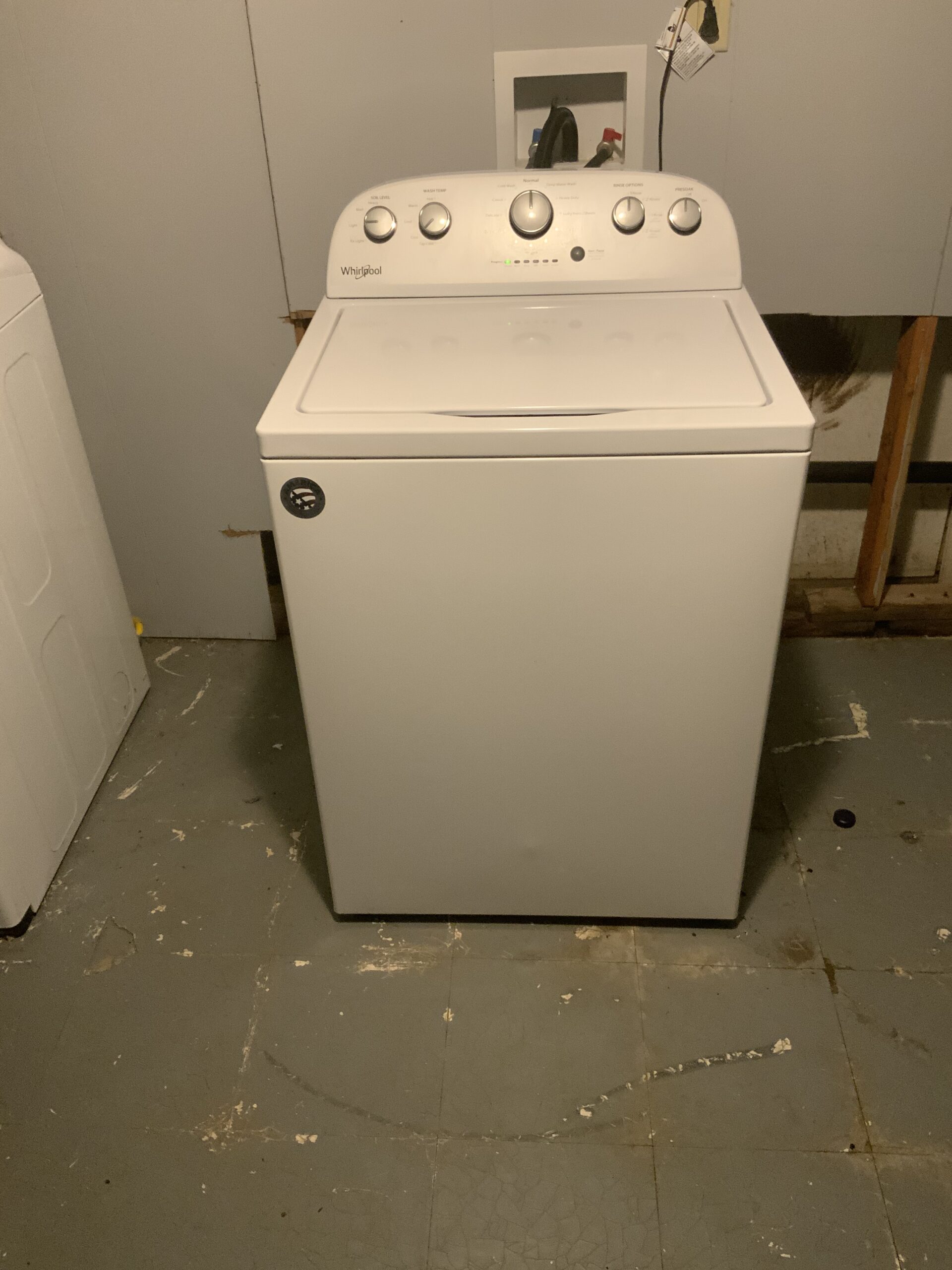 Whirlpool washer model WTW5000DW2 repaired in Canton, OH showing lid lock and hub replacement.